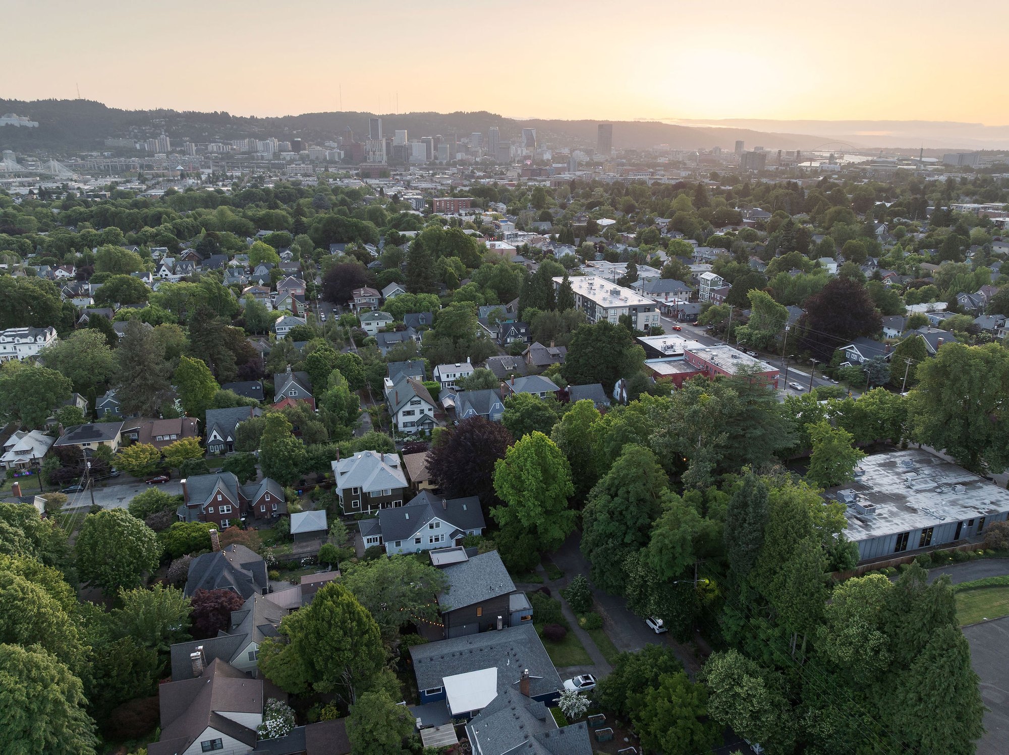 Aerial view over Hosford-Abernethy toward downtown Portland at sunset